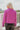 Back view of the Give Me A Beat Cropped Blazer features a purple colored material, a collar and lapel, a front button closure, and long sleeves.
