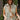 Front view of model wearing the Keep Them Guessing Hooded Vest, that has a green nylon material, a sleeveless design, a button-up front, 2 front hidden pockets, and a heather grey hood. Styled with crossbody purse.