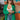 Frontal view of the Blakely Blazer In Green that features a green material, a collar and lapel, a two button front closure, a long sleeve, shoulder pads, two front pockets, and a back slit.
