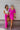 Frontal view of the Sitting Pretty Mini Dress that features a magenta colored chiffon material, a surplice neckline, short sleeves, a surplice front, a back zipper, and a mini length