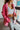 Frontal view of the Seasons Change Jacket that features a pink colored corduroy material, a collar and lapel neckline, a two button front closure, a long sleeve, two front pockets, and a back slit.
