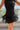 Frontal view of the Twist and Shout Mini Skirt that features a black colored suede material, a high-rise fit, layered fringe detailing through out, a mini length, and a side zipper closure.