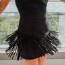 Frontal view of the Twist and Shout Mini Skirt that features a black colored suede material, a high-rise fit, layered fringe detailing through out, a mini length, and a side zipper closure.