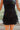 Frontal view of the Twist and Shout Mini Skirt that features a black colored suede material, a high-rise fit, layered fringe detailing through out, a mini length, and a side zipper closure.