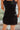 Back view of the Twist and Shout Mini Skirt that features a black colored suede material, a high-rise fit, layered fringe detailing through out, a mini length, and a side zipper closure.