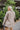 Back view of the Seasons Change Jacket that features a brown corduroy material, a collar and lapel neckline, a two button front closure, a long sleeve, two front pockets, and a back slit.
