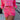 Close-up front view of model wearing the Out Of Your League Shorts which feature a hot pink material, an elastic waist band with adjustable ties, front pockets, a patchwork design, and two back pockets