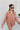 Frontal view of the Jump Start Top that features a marsala colored material, a collar neckline, a button-up front, a cuffed long sleeve, a front pocket a high-low design, and a flowy fit