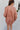 Back view of the Jump Start Top that features a marsala colored material, a collar neckline, a button-up front, a cuffed long sleeve, a front pocket a high-low design, and a flowy fit