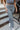 Frontal view of the Half Of My Heart Pants that features a black and white gingham pattern, an elastic waist band, a high-rise fit, and a middle seam down the leg.