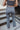 Back view of the Half Of My Heart Pants that features a black and white gingham pattern, an elastic waist band, a high-rise fit, and a middle seam down the leg.