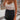 Frontal view of the I'm So Fancy Skirt that features a black colored material, a high-rise fit, a feather detailed hem, a back zipper closure, and a mini length.