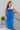 Frontal view of the Royalty Midi Dress that features a royal blue silk material, a sleeveless design with thin adjustable straps, a bustier design, a back zipper closure, and a midi length