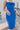 Frontal view of the Royalty Midi Dress that features a royal blue silk material, a sleeveless design with thin adjustable straps, a bustier design, a back zipper closure, and a midi length