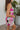 Side view of the Meet Me At The Disco Dress that features a multi-colored print, a V neckline, a sleeveless design with thin adjustable straps, a back zipper closure, and a mini length.