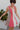 Frontal view of the All Caught Up Dress that features a multi-colored denim material, a square neckline, a sleeveless design with thick straps, a color block design, and a side zipper closure.