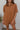 Frontal view of the Lady May Romper that features a brown fabric, a collar neckline, a short cuffed sleeve, a button-up front, two front pockets at the chest, a cuffed bottom hem, and two back pockets.