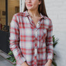 Frontal view of the Home Sweet Top that features a flannel material, a multi-colored plaid, a collar neckline, a button-up front, a front pocket, and a long cuffed sleeve.