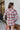 Back view of the Home Sweet Top that features a flannel material, a multi-colored plaid, a collar neckline, a button-up front, a front pocket, and a long cuffed sleeve.