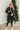 Full body front view of model wearing the Next Adventure Puffer Jacket in Black that has a black nylon material, a puffer design, a long sleeve, a zip-up front, and front pockets. 