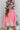 Front view of model wearing the All I Want Sweater, which features pink knit fabric with thick ribbed trim, a high round neck, and drop-shoulder long sleeves with folded cuffs