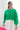 Front view of model wearing the Make A Statement Sweater in Green that has green knit fabric, a cropped waist, a round neckline, and long balloon sleeves