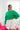Front view of model wearing the Make A Statement Sweater in Green that has green knit fabric, a cropped waist, a round neckline, and long balloon sleeves
