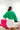 Back view of model wearing the Make A Statement Sweater in Green that has green knit fabric, a cropped waist, a round neckline, and long balloon sleeves