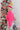 Side view of model wearing the Make A Statement Sweater in Pink that has pink knit fabric, a cropped waist, a round neckline, and long balloon sleeves.