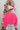 Back view of model wearing the Make A Statement Sweater in Pink that has pink knit fabric, a cropped waist, a round neckline, and long balloon sleeves.