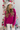 Front view of model wearing the Favorite Time Of Year Sweater which features dark fuchsia knit fabric, a v-neckline, ribbed trim detailing, and long balloon sleeves.