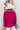 Back view of model wearing the Favorite Time Of Year Sweater which features dark fuchsia knit fabric, a v-neckline, ribbed trim detailing, and long balloon sleeves.