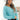 Front view of model wearing the Go Boldly Chenille Sweater in Blue that has blue chenille fabric, a cropped waist, a v-neckline, and long batwing sleeves