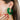 Side view of model wearing the You Give Me Joy Earrings in Green is an open hoop style earring, featuring green textured frills.