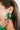 Side view of model wearing the You Give Me Joy Earrings in Green is an open hoop style earring, featuring green textured frills.