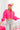 Front view of model wearing the Make A Statement Sweater in Pink that has pink knit fabric, a cropped waist, a round neckline, and long balloon sleeves.
