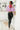 Full body front view of model wearing the Good Mood Hooded Sweater that has lavender ribbed knit fabric, a cropped waist, a v neckline with a hood,  and dropped-shoulder long sleeves.
