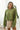 Front view of model wearing the Warm And Fuzzy Pullover in Olive that has soft fleece fabric, long raglan sleeves, ribbed trim, and a round neckline.