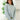Front view of model wearing the No Plans Pullover Hoodie  in Blue that has waffle-knit fabric, long batwing sleeves, a hood with an ivory drawstring, and a wide fit