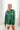 Front view of model wearing the Fancy Me Satin Top in Green which features emerald green satin fabric, a button-up front with a collared neckline, one chest pocket, and long sleeves with buttoned cuffs.