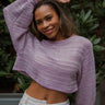 Front view of model wearing the Fresh Start Top that has lilac and white loose-knit fabric with stitched stripes, a cropped waist, a round neckline, and long balloon sleeves with cuffs