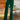 Frontal view of the With The Flow Pants that features a green colored velvet material, a high-rise fit, a side zipper, and a wide leg fit.