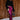 Full body view of model wearing the Lainey Magenta Slit Midi Skirt which features fuchsia and black shimmer pleated fabric, midi length, slit on the side, thigh length fuchsia lining and elastic waistband.