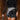 Front view of model wearing the Zara Black & Silver Sequin Mini Skirt which features black sequin and silver sequin fabric, colorblock design, black lining, mini length and back zipper.