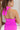 Close-up back view of model wearing the Don't Be Shy Dress , which features a purple material, a halter neck with a tie, pleat details on the straps, an open back, and a back zipper closure.