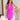 front view of model wearing the Don't Be Shy Dress , which features a purple material, a halter neck with a tie, pleat details on the straps, an open back, and a back zipper closure.