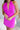 Close-up front view of model wearing the Don't Be Shy Dress , which features a purple material, a halter neck with a tie, pleat details on the straps, an open back, and a back zipper closure.