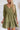 Frontal view of the Wish You Well Dress that features an olive gauze material, a frayed V neckline, a 3/4 sleeve, a button-up front, a tiered babydoll design, a flowy fit, and a mini length. 