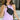 Close up view of model wearing the Travel In Style Sling Bag in Black which features black fabric, gold zipper closure and adjustable black strap with gold hardware.
