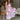 Full body view of model wearing the In My Favor Midi Dress which features a hot pink, light pink, green, blue and lavender color block pattern, tiered ruffle details, a pink skirt lining, a square neckline, adjustable straps, a smocked back, and a monochr
